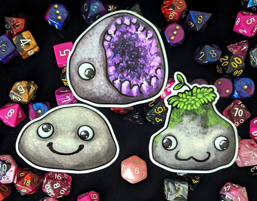 The 3 pet rock stickers, in close up.
