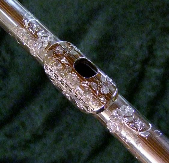 The mouth piece of her flute, which belonged to her mother, is engraved.
