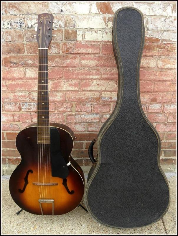 A 40's harmony silvertone acoustic. He got it from his grandma Agnes. Nicknamed Layla.