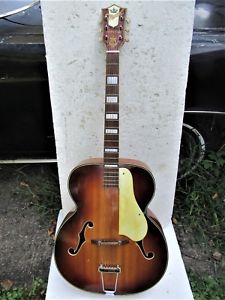 A 1950's kay archtop named Idina. He got her at age 6.