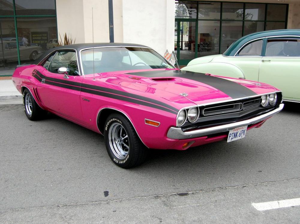 A 1970 Dodge Challenger in panther pink. She bought it when she was 19.