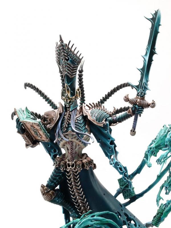 Nagash with his sword and looking in his book