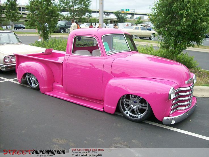 A rebuilt 1954 chevy truck painted hot pink. He and his dad restored it. He's had it since he was 16.