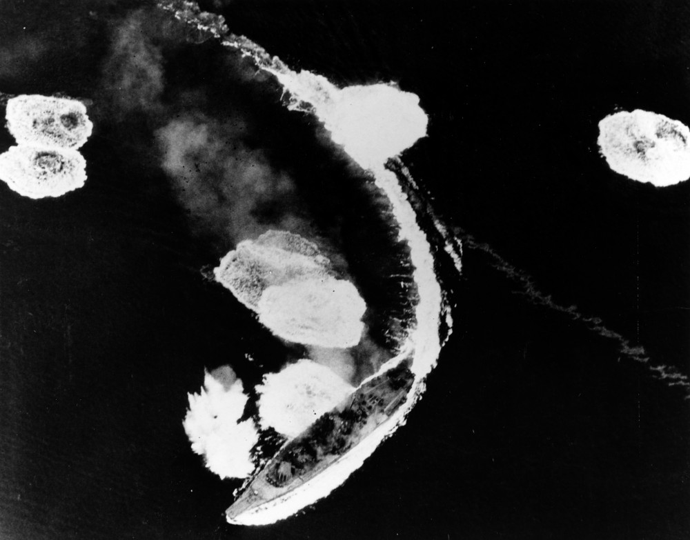 Yamato maneuvering under heavy American air attacks by the US Navy's Task Force 58 on March 19, 1945. Yamato was not seriously damaged by the attack, and the photo came from one of USS Hornet (CV-12)'s planes.