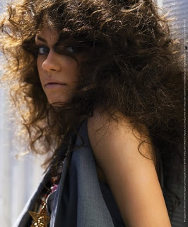 Sable with her hair down (portrayed by Mila Kunis)