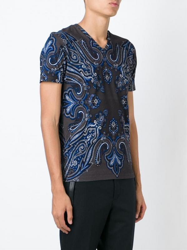 A blue paisley shirt. He has several that are identical. He also keeps the same paisley style in various colors.