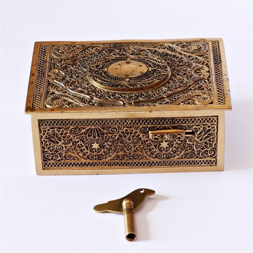 Fairly hefty music box, always on the bedside table in his room. Upon closer inspection, the inside is a complex composition of gears and strings with an image of Hermes on the inside of the lid.