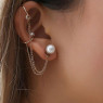 Pearl replaced by Emerald earrings. Gold chain & cartilege cuffs on right ear.