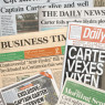 Random modern newspapers strewn haphazardly on each other. Headlines include: "Captain Carter alive and well", "Carter foils another Hydra plot", "CARTER SAVES CAPITAL".