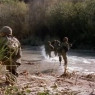 Squad crossing river into Cambodia