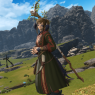 A full body screenshot. Ilakha poses with a smile in traditional Auri clothing. The Steppe village of Reunion can be seen in the background.