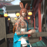 A full-body screenshot. Fane smiles and folds his hands together. He is on a balcony in Kugane.