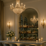 Nestled along the eastern wing of the Grand Winter Hall, glowing with golden light and soft laughter. • A marble bar lined with crystal decanters reflects candlelight like starlight on snow. • Plush velvet seating invites quiet conversation