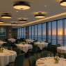 The Coral Café & Grand Dining Hall Golden light spills through wide windows as the sun sets over the sea. Crystal chandeliers shimmer above white linen tables, and soft music drifts between the laughter of guests. Elegant, warm, and timeless.