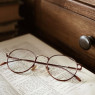 Only needs them for reading, which she does a lot. So she rarely takes them off.