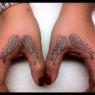 Hand tattoos.