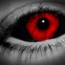 The iris is a blood or crimson red with the whites of her eyes pitch black