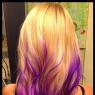 This is the STYLE of her hair as far as "wavy" goes. Does not fully represent color or length.