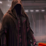 He usually wears a dark brown hooded armorweave robe over a set of darkly colored durasteel armor.