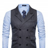 Black waistcoat, light blue shirt with a navy blue tie, black pants and dress shoes