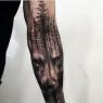 Lower inside right arm. Trees go all the way around the forearm